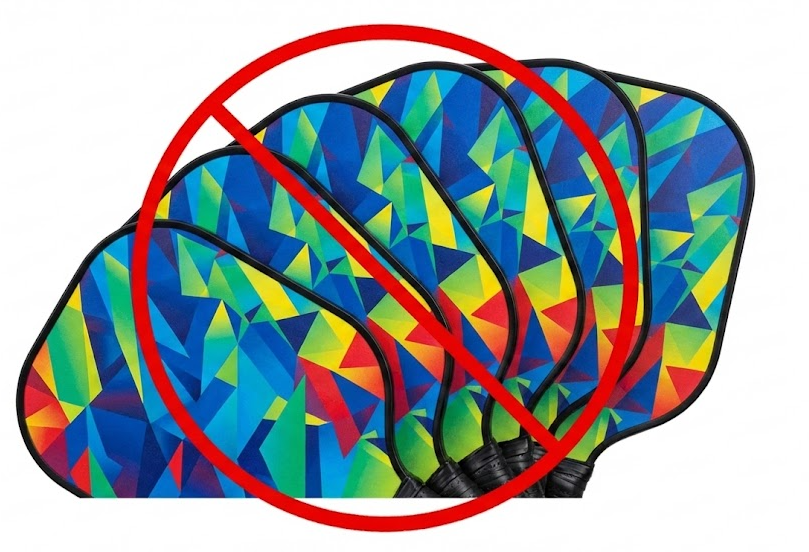 Red circle slash over several colorful pickleball paddles, signifying 'no'.