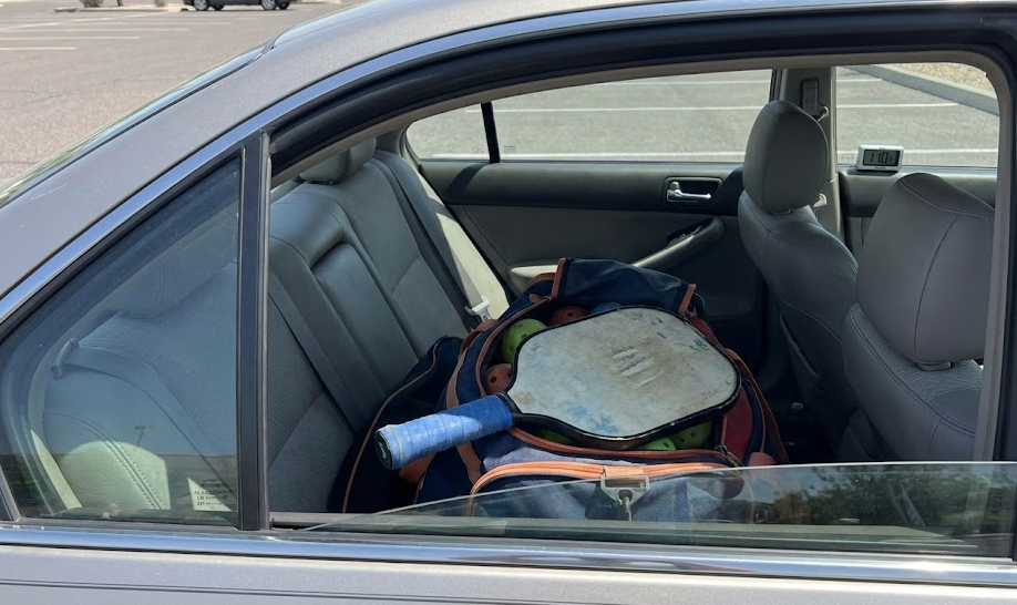 Pickleball paddles and bag in car backseat