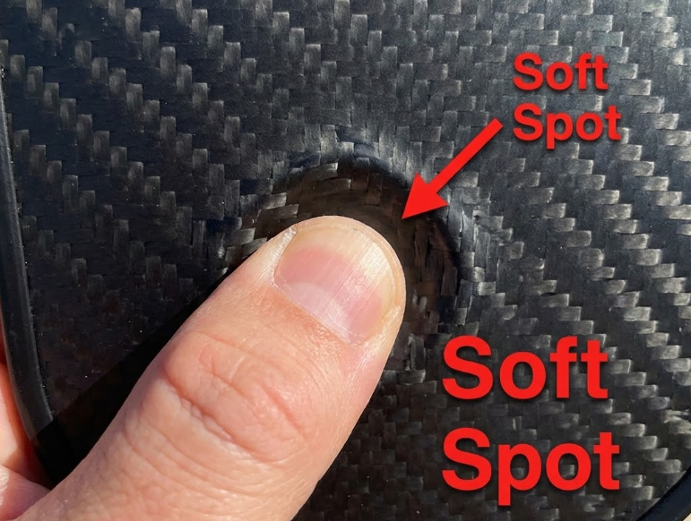 Soft spot on paddle face indicates when to replace pickleball paddle due to wear.